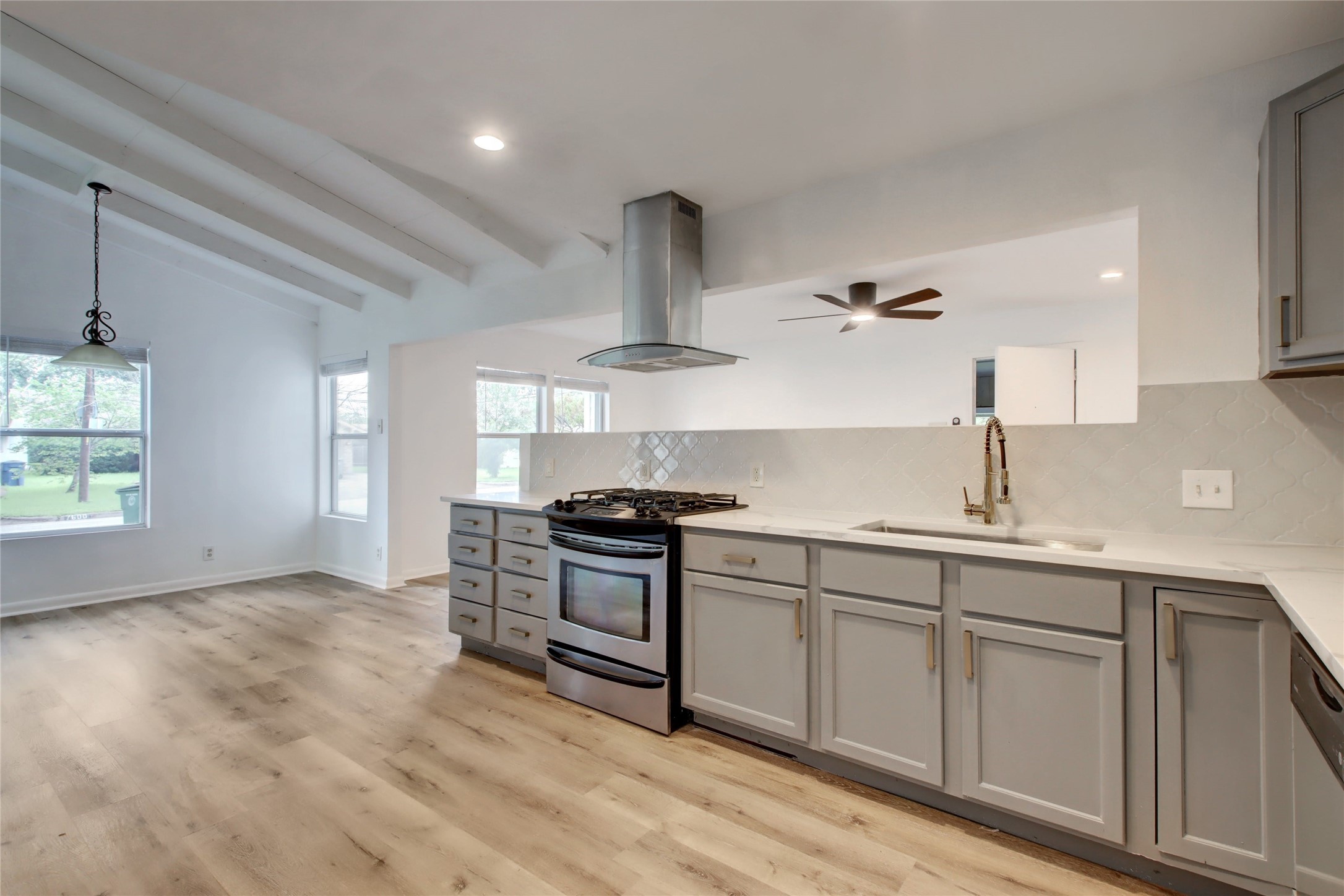 1906 Morrow Street Austin, TX 78757 - Photo 11 of 36 a kitchen with granite countertop a sink stainless steel appliances and cabinets
