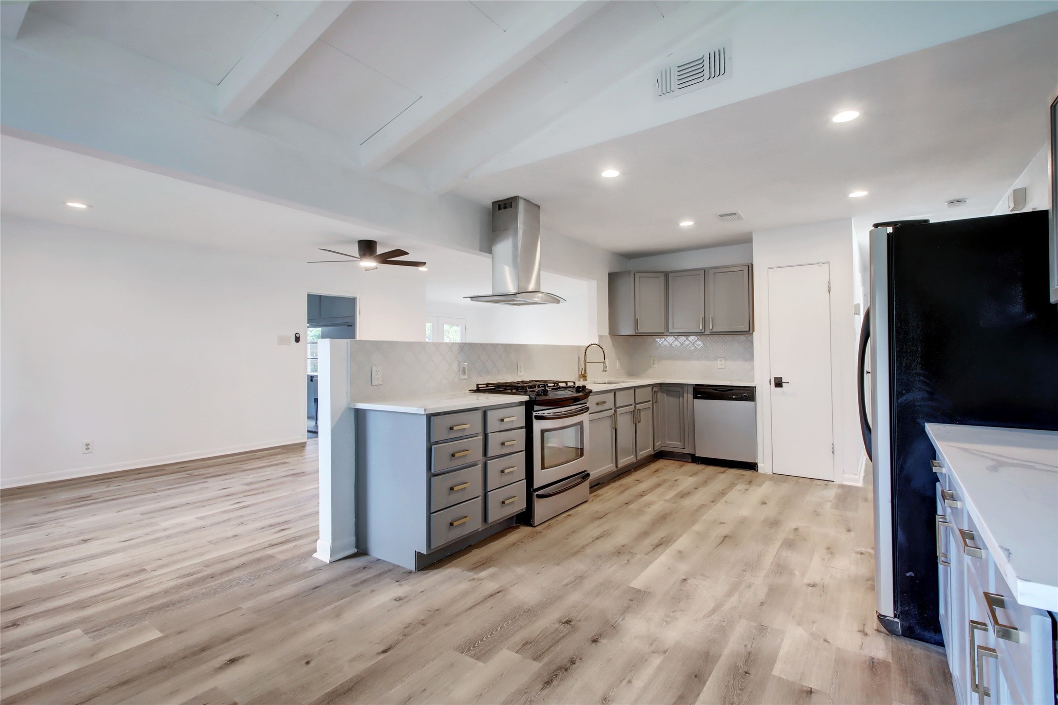 1906 Morrow Street Austin, TX 78757 - Photo 14 of 36 a kitchen with stainless steel appliances a sink and a stove top oven
