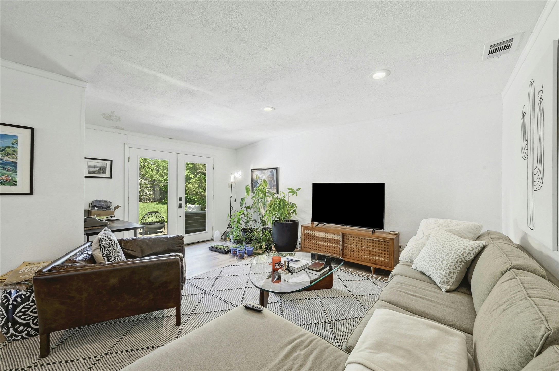 1906 Morrow Street Austin, TX 78757 - Photo 15 of 36 a living room with furniture and a flat screen tv