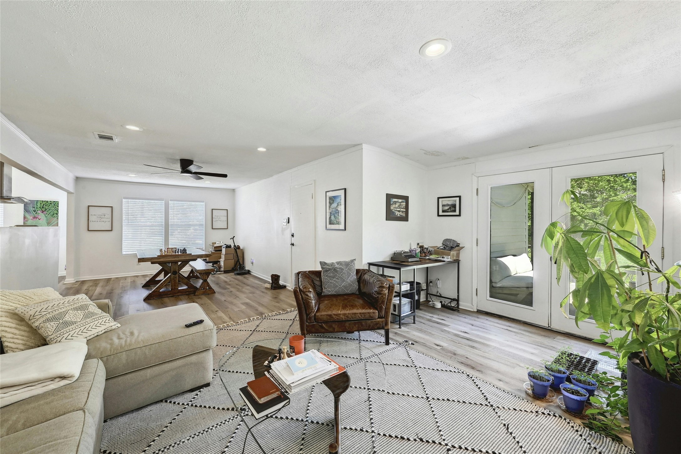 1906 Morrow Street Austin, TX 78757 - Photo 17 of 36 a living room with furniture potted plant and a window