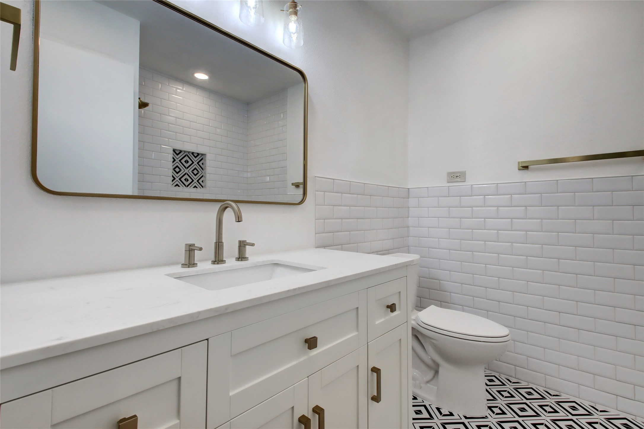1906 Morrow Street Austin, TX 78757 - Photo 26 of 36 a bathroom with a toilet sink and mirror