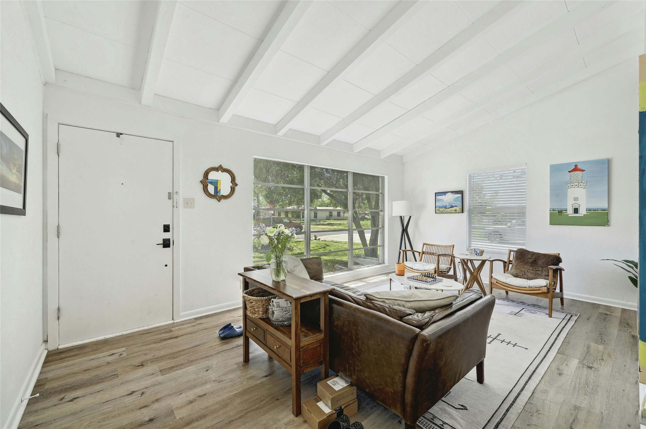 1906 Morrow Street Austin, TX 78757 - Photo 3 of 36 a view of a livingroom with furniture wooden floor and windows