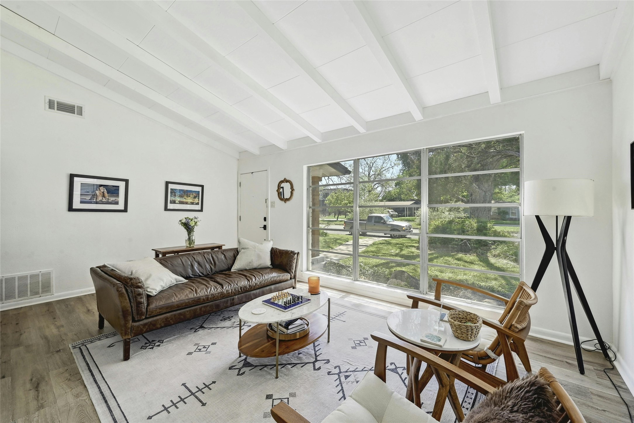 1906 Morrow Street Austin, TX 78757 - Photo 5 of 36 a living room with furniture and a floor to ceiling window