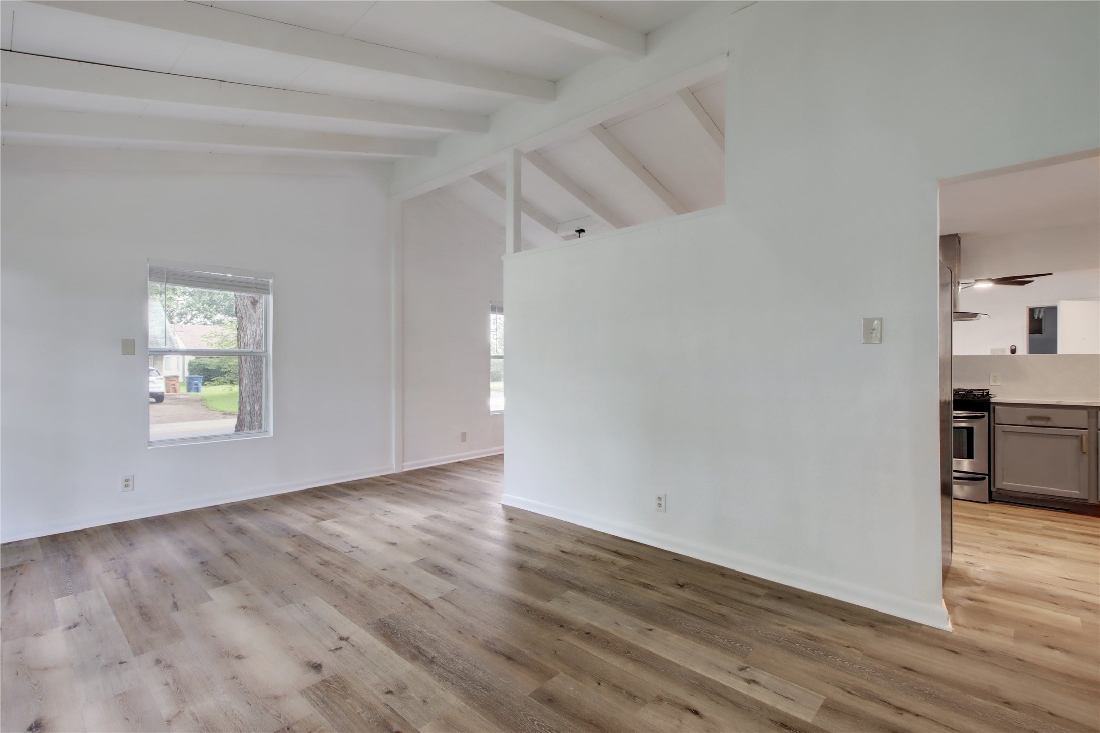 1906 Morrow Street Austin, TX 78757 - Photo 7 of 36 a view of empty room with wooden floor and window