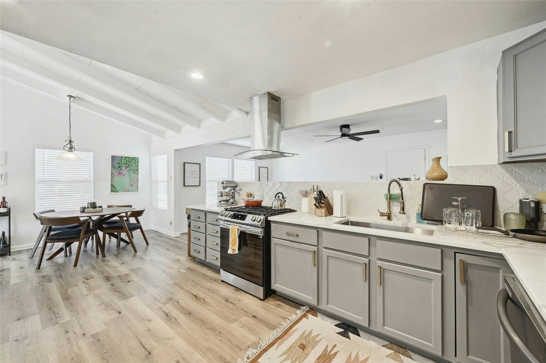 1906 Morrow Street Austin, TX 78757 - Photo 10 of 36 a kitchen with sink cabinets and window