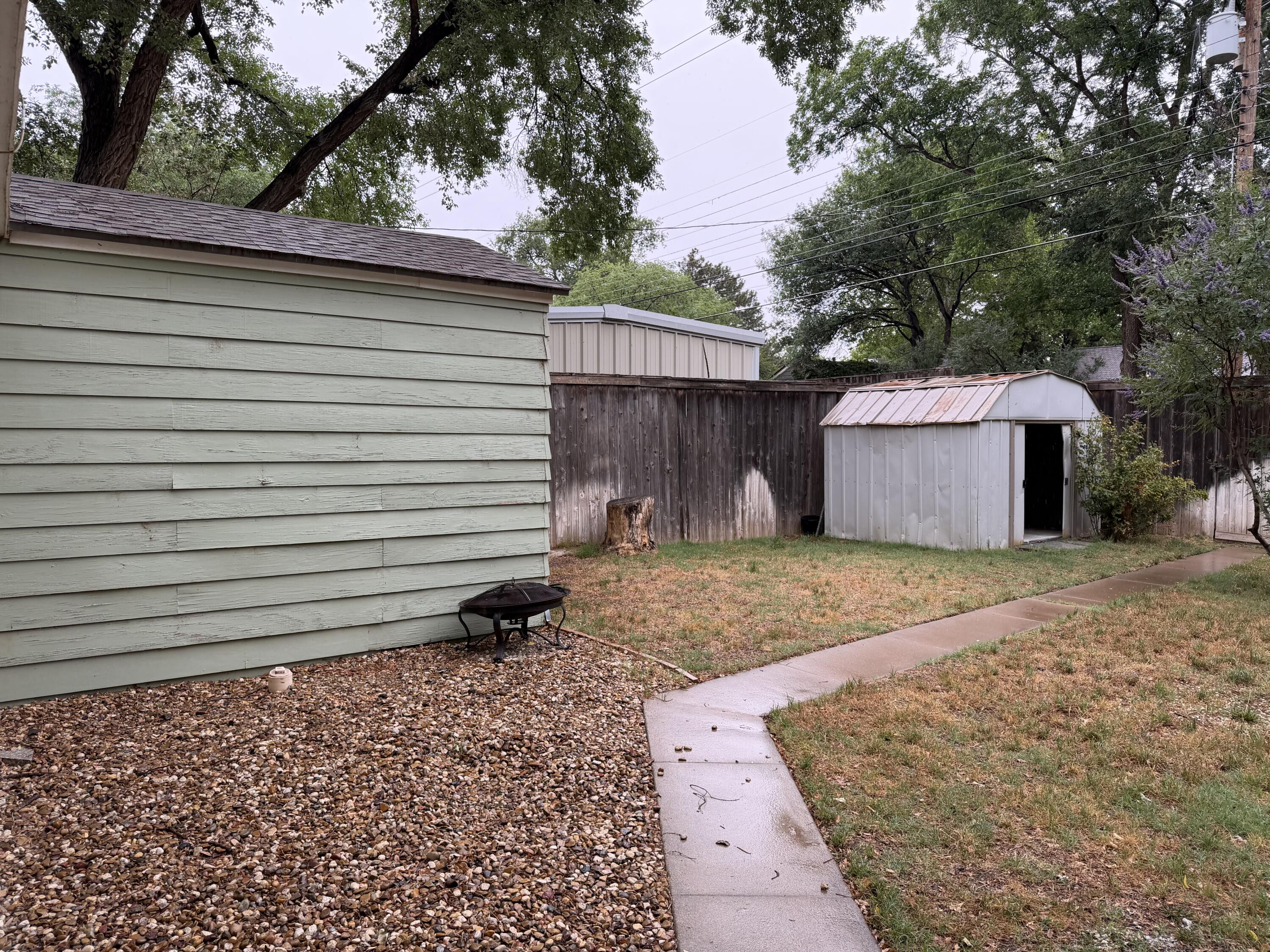 3110 22nd Street Lubbock, TX 79410 - Photo 22 of 22 a view of a house with a yard and a tree