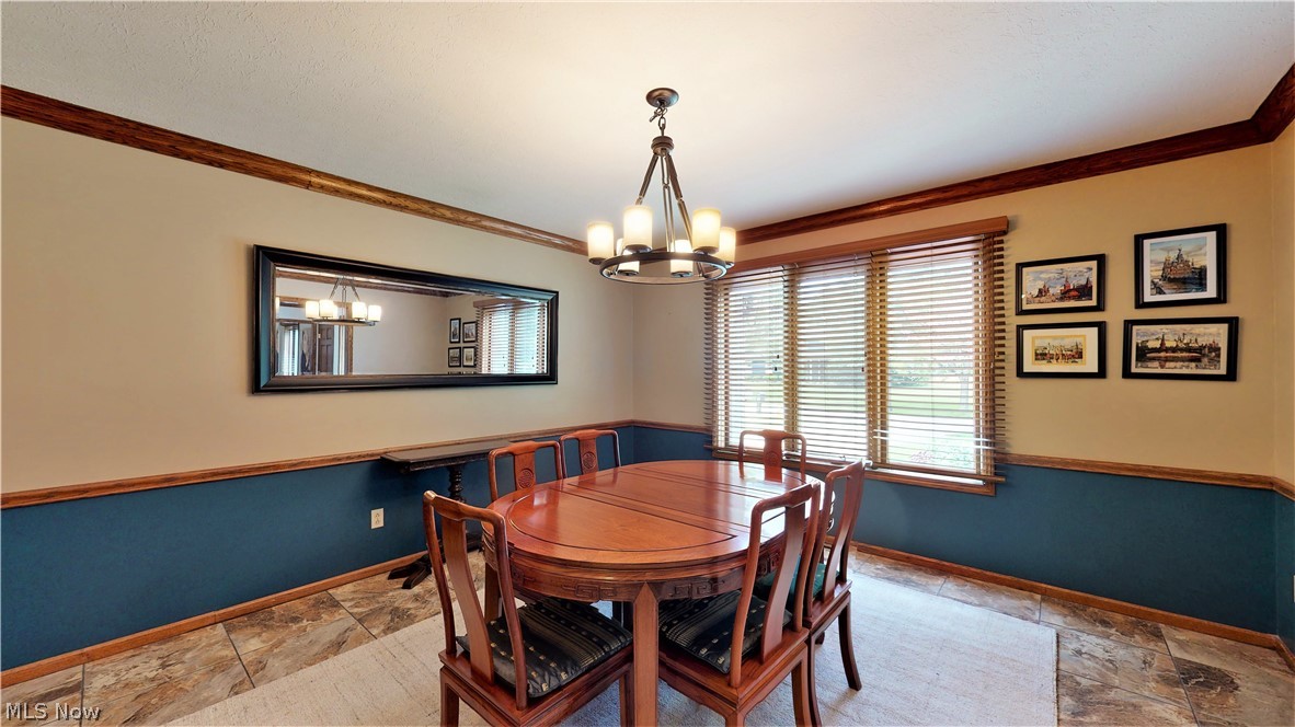 2549 Sourek Road Akron, OH 44333 - Photo 7 of 28 Dining Room is off of the main entrance and connects to the kitchen by a separate doorway. A great place to gather with friends and family.