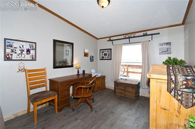 9780 Hahn Road Calhan, CO 80808 - Photo 8 of 27 From kitchen there is an office off the master