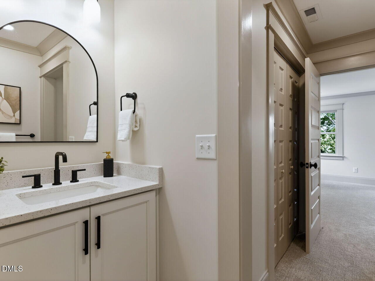 504 Tilden Street Raleigh, NC 27605 - Photo 44 of 58 a bathroom with a double vanity sink and a mirror