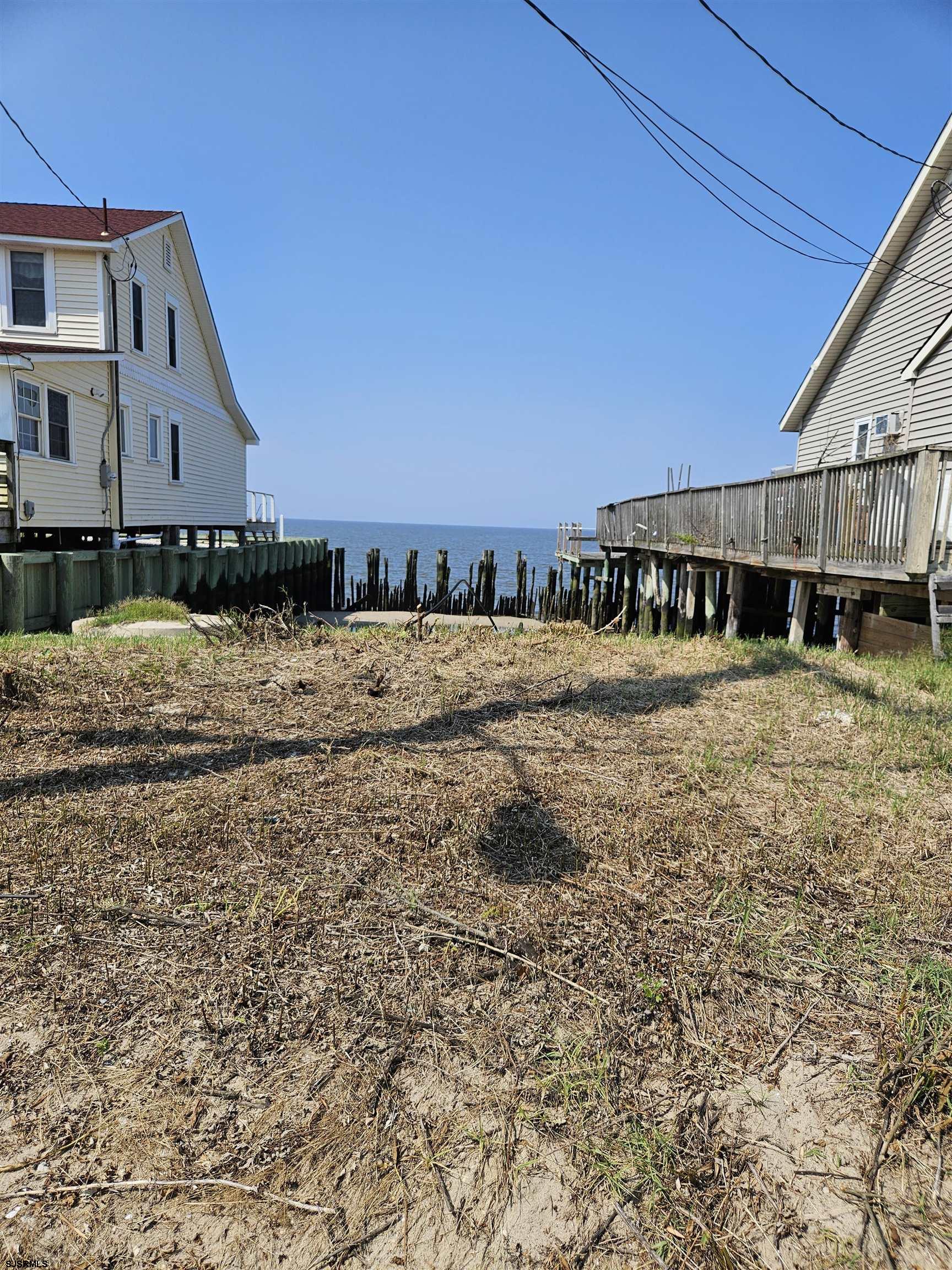 116 Delaware Avenue Fortescue, NJ 08321 - Photo 2 of 5 a view of swimming pool with outdoor seating and house in the background