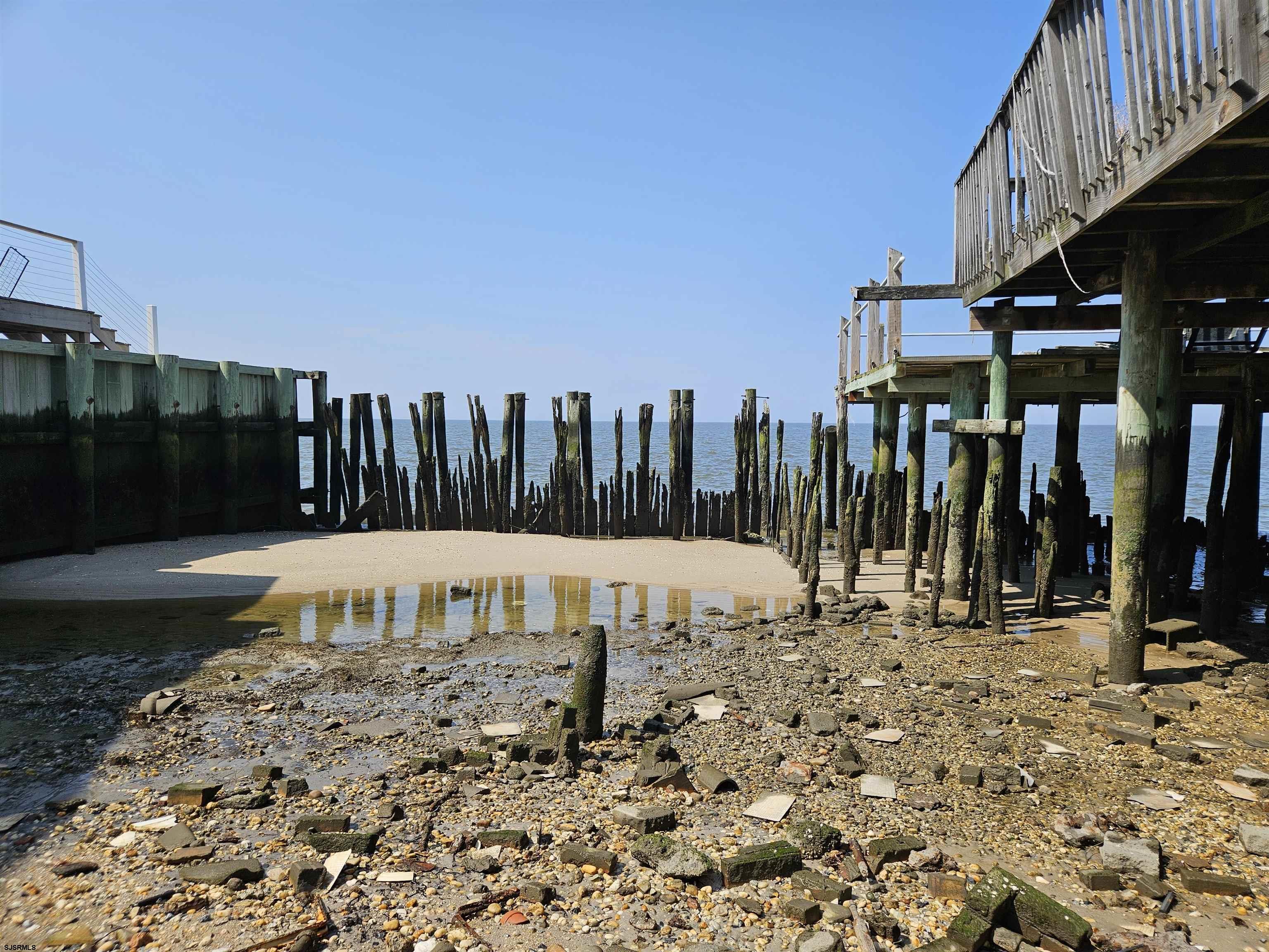 116 Delaware Avenue Fortescue, NJ 08321 - Photo 3 of 5 a view of a terrace with a bench