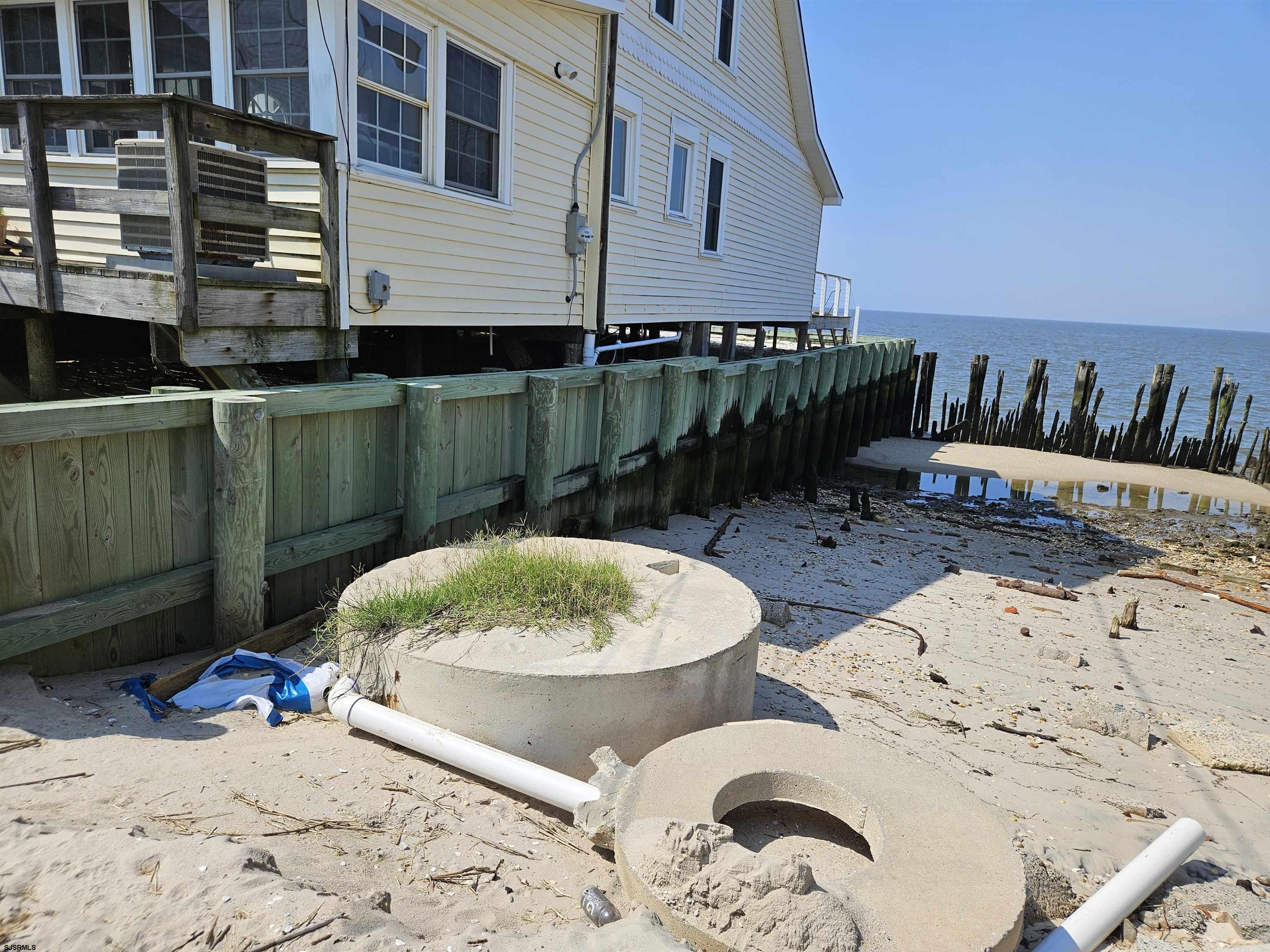116 Delaware Avenue Fortescue, NJ 08321 - Photo 5 of 5 a view of a backyard with furniture and a swimming pool