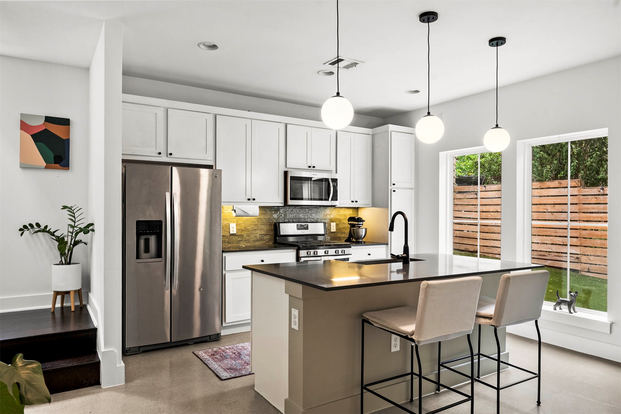 1213 Eleanor Street, Unit B Austin, TX 78721 - Photo 13 of 35 Plenty of cabinet storage means you can keep the quartz countertops clear and the space feeling organized