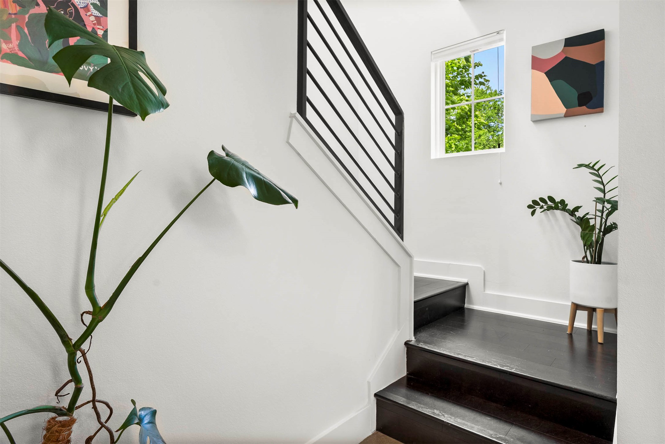 1213 Eleanor Street, Unit B Austin, TX 78721 - Photo 20 of 35 Head upstairs where the flooring transitions to warm wood, leading to both private bedroom suites
