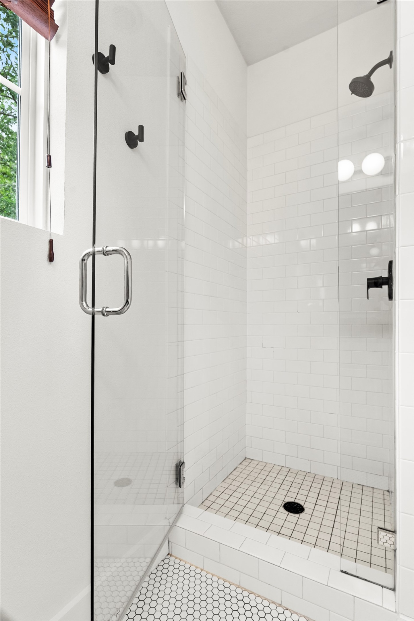 1213 Eleanor Street, Unit B Austin, TX 78721 - Photo 23 of 35 The ensuite bathroom features a step-in shower with modern tile work for a clean, refreshed start to your day