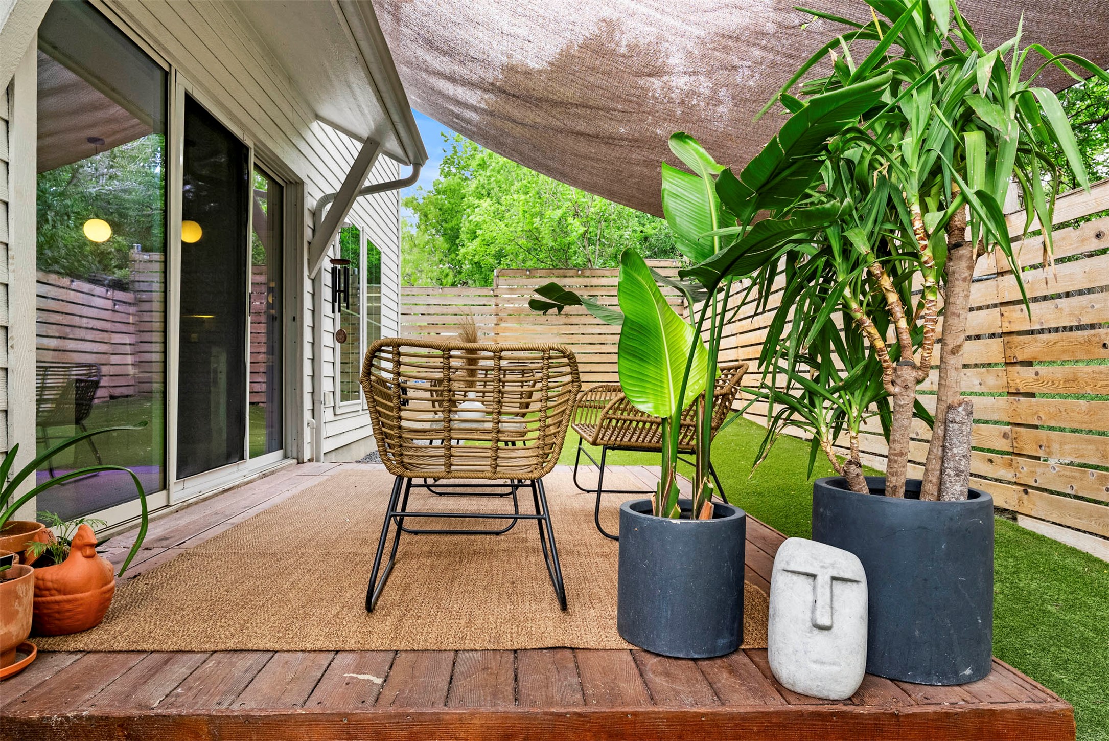 1213 Eleanor Street, Unit B Austin, TX 78721 - Photo 30 of 35 Step out from the living area onto the deck to enjoy a quiet evening overlooking your private backyard