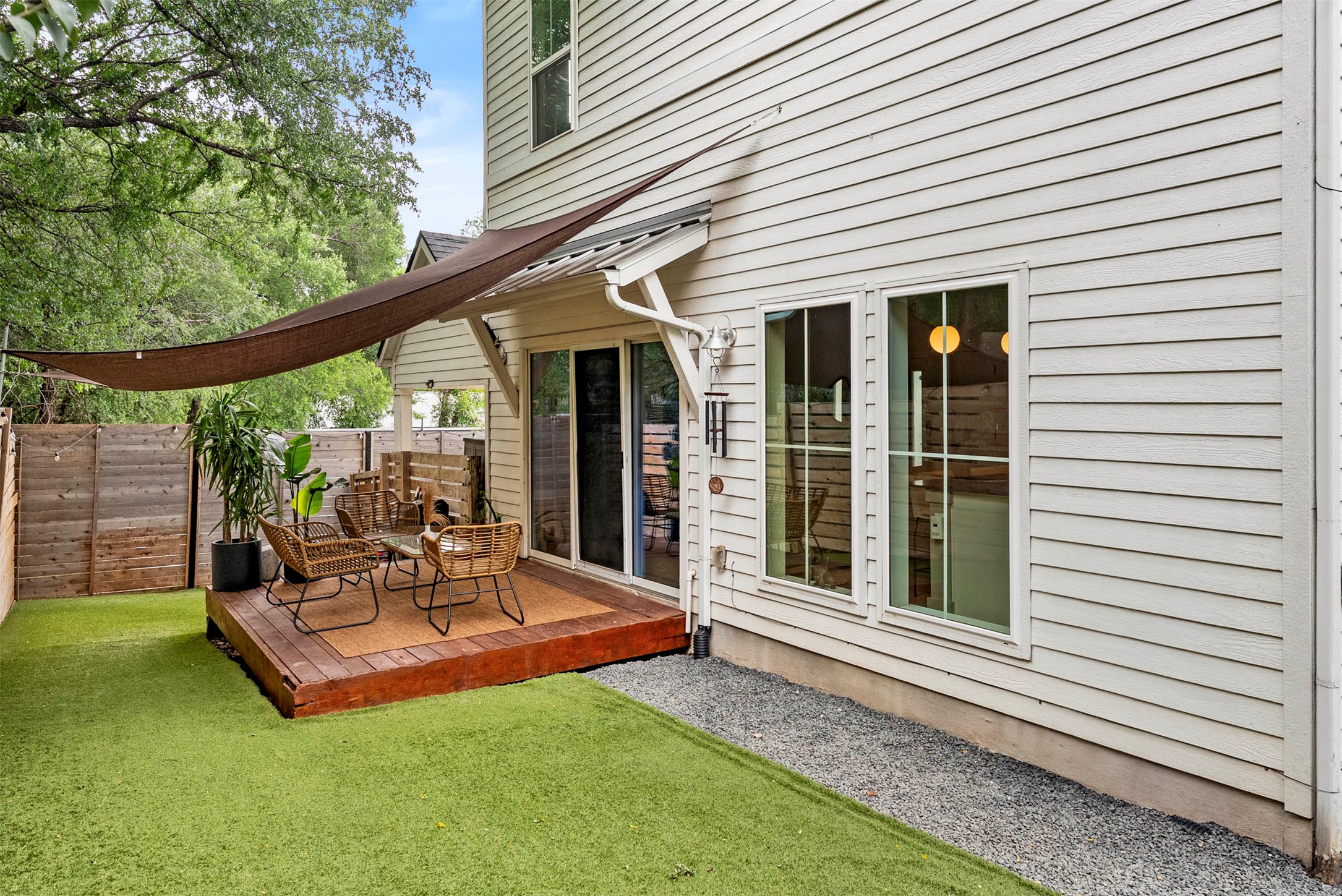 1213 Eleanor Street, Unit B Austin, TX 78721 - Photo 31 of 35 This backyard is huge for the area and features high-quality turf, so it stays green and easy to care for all year