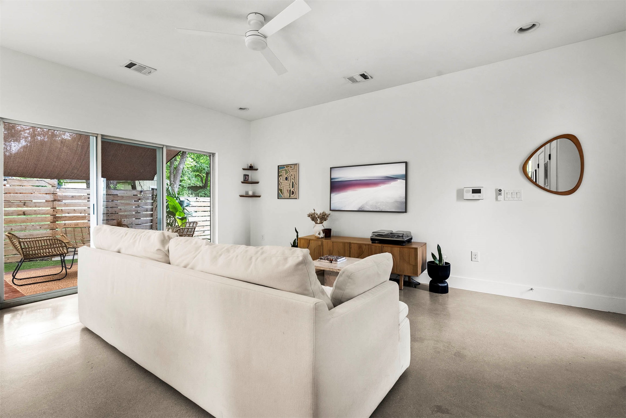 1213 Eleanor Street, Unit B Austin, TX 78721 - Photo 7 of 35 The open flow between the living room and kitchen ensures you are always part of the conversation while hanging out