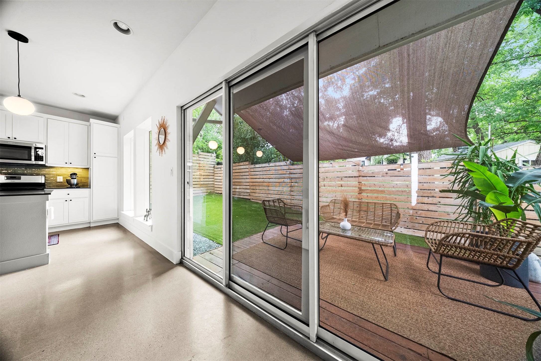 1213 Eleanor Street, Unit B Austin, TX 78721 - Photo 10 of 35 These stackable sliding glass doors completely disappear to connect your indoor lounging with the back deck