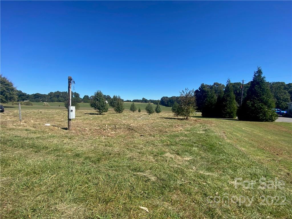 3363 Humphries Road Shelby, NC 28150 - Photo 2 of 8 a view of a field with a tree in the background