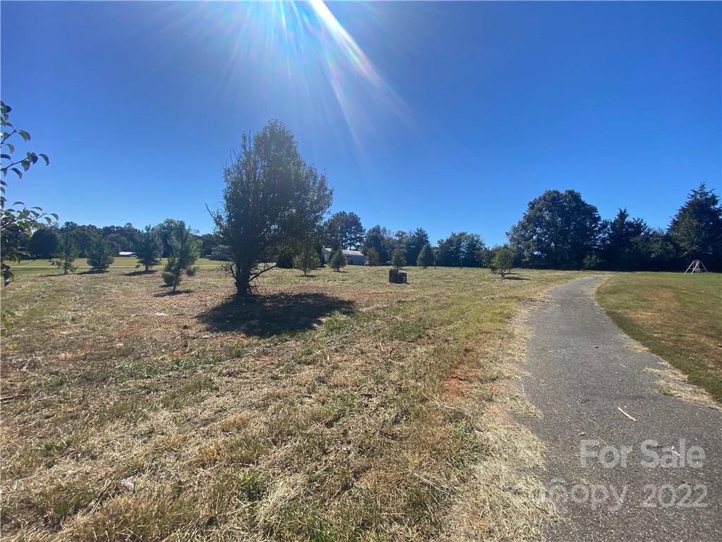 3363 Humphries Road Shelby, NC 28150 - Photo 5 of 8 a view of a field with a tree in background