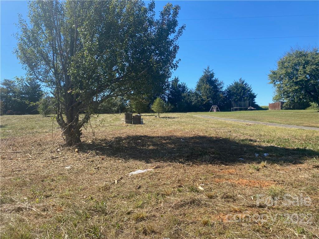 3363 Humphries Road Shelby, NC 28150 - Photo 8 of 8 a view of a yard with a tree