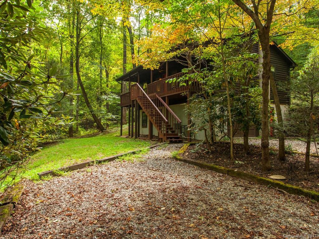 99 Apgar Road Candler, NC 28715 - Photo 1 of 20 a view of a house with a yard and sitting area
