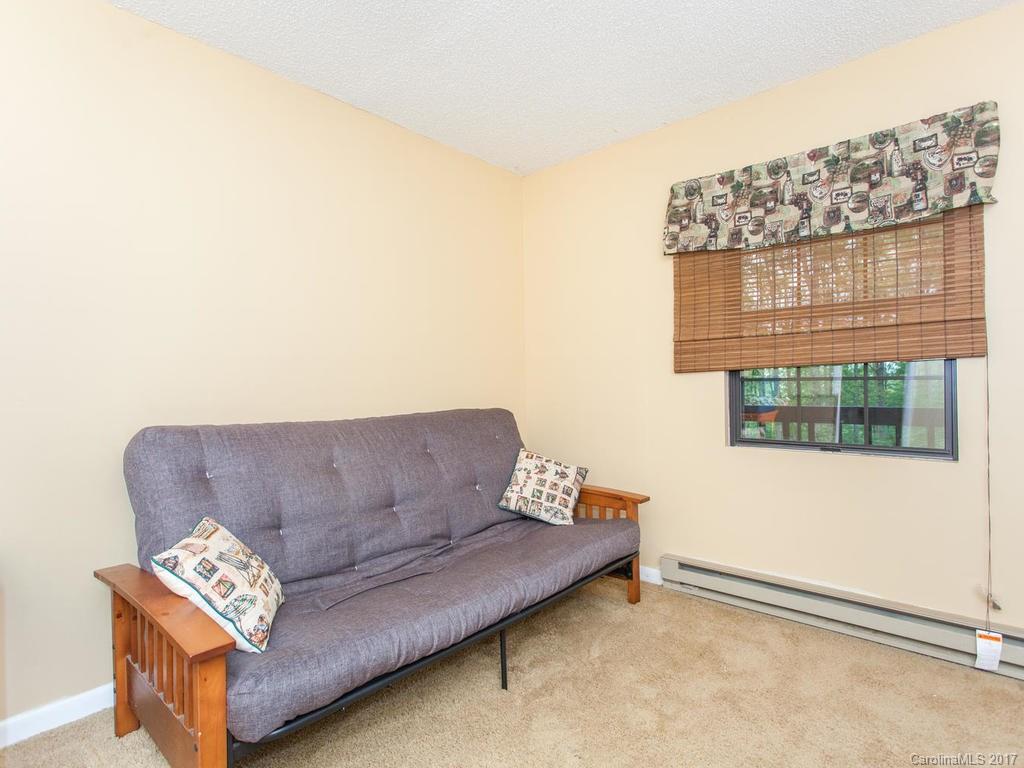 99 Apgar Road Candler, NC 28715 - Photo 12 of 20 a living room with furniture and a window