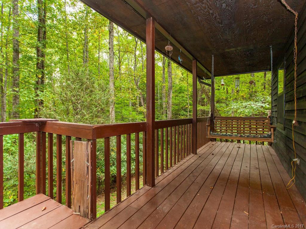 99 Apgar Road Candler, NC 28715 - Photo 14 of 20 a view of balcony with wooden floor