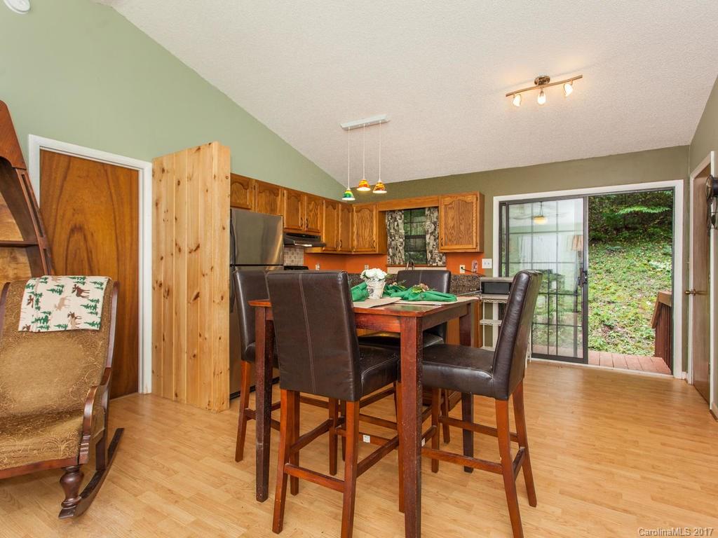 99 Apgar Road Candler, NC 28715 - Photo 3 of 20 a dining room with furniture and window