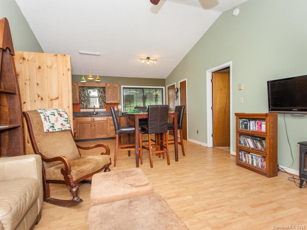 99 Apgar Road Candler, NC 28715 - Photo 9 of 20 a living room with furniture and a flat screen tv