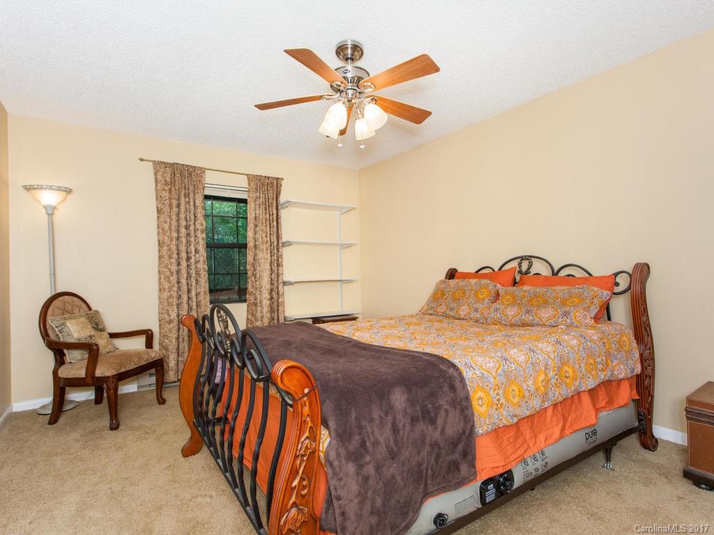 99 Apgar Road Candler, NC 28715 - Photo 10 of 20 a bedroom with a bed and a window