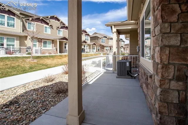 a view of a brick house with a large windows