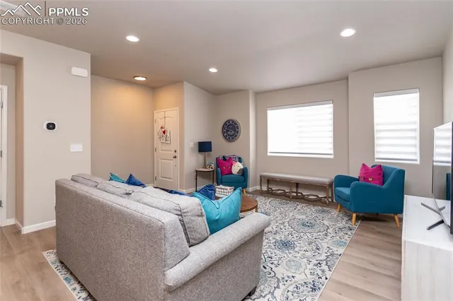 a living room with furniture and a window