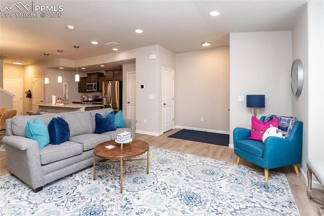 a living room with furniture and a rug