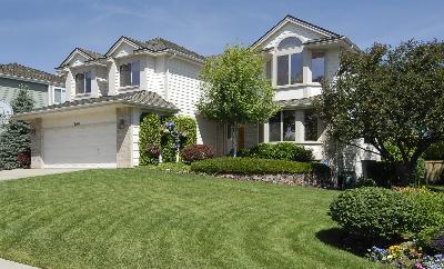 9569 Dolton Way Highlands Ranch, CO 80126 - Photo 1 of 1 a front view of a house with a yard and garage