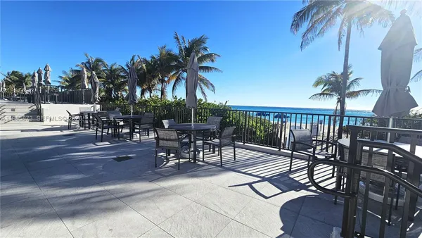 a view of a swimming pool with chairs