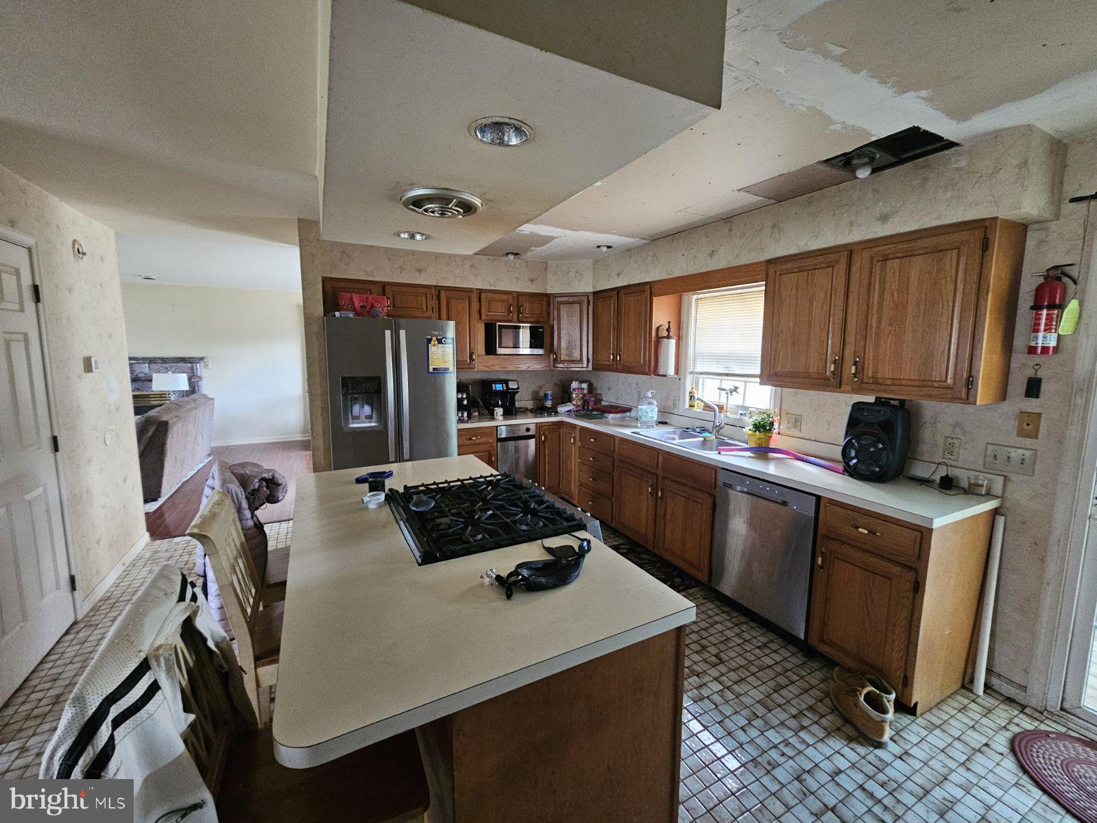 6520 Old Carlisle Road Dover, PA 17315 - Photo 9 of 24 a kitchen with stainless steel appliances a stove a sink dishwasher a refrigerator a sink and cabinets