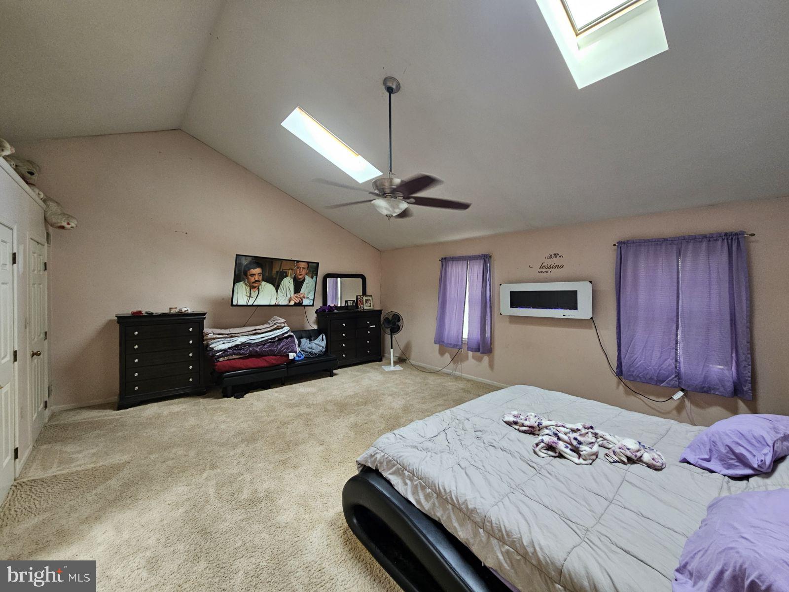 6520 Old Carlisle Road Dover, PA 17315 - Photo 10 of 24 a bedroom with a bed and a chandelier