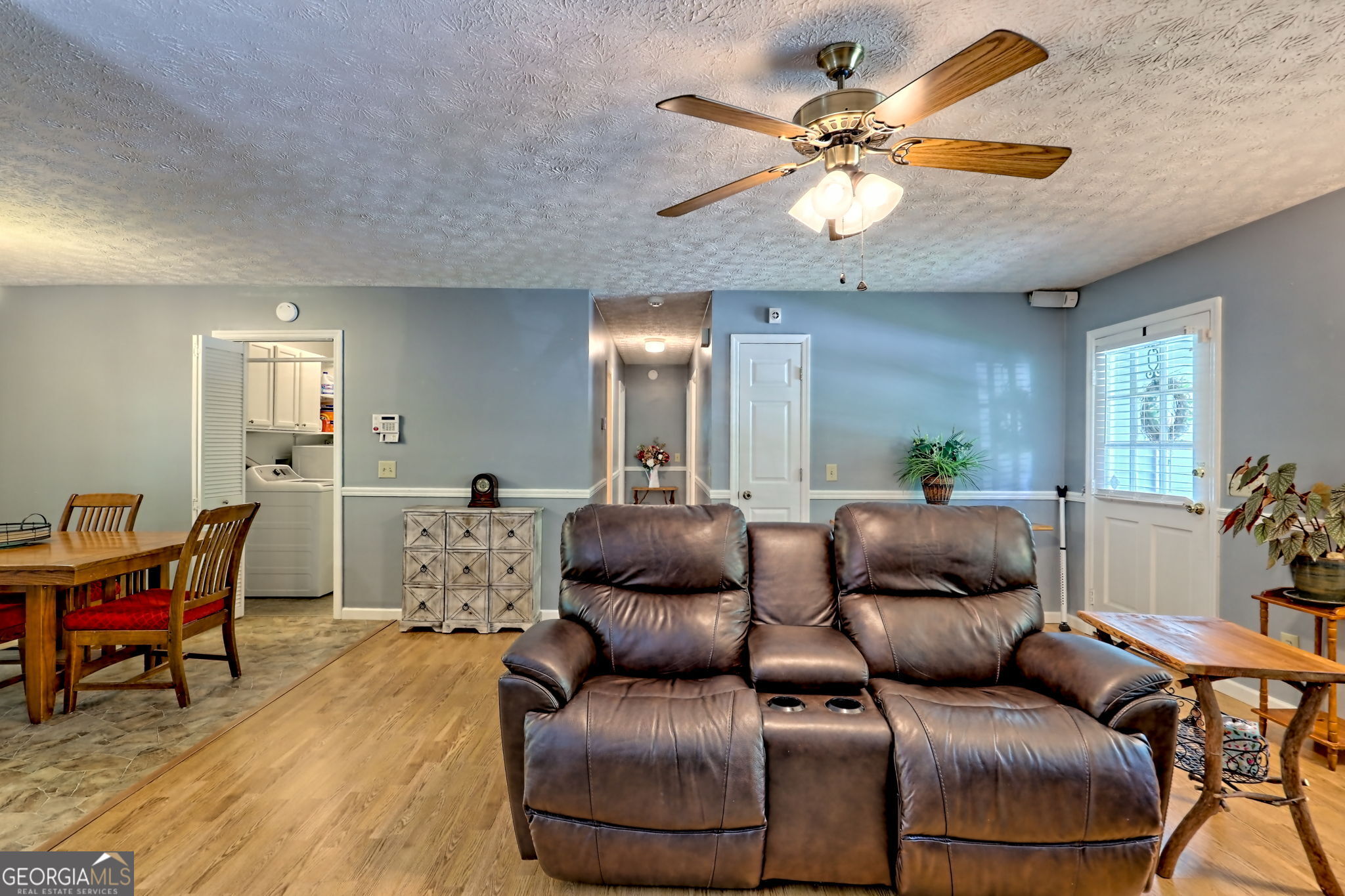 101 Long Street Demorest, GA 30535 - Photo 16 of 61 a living room with furniture and a chandelier