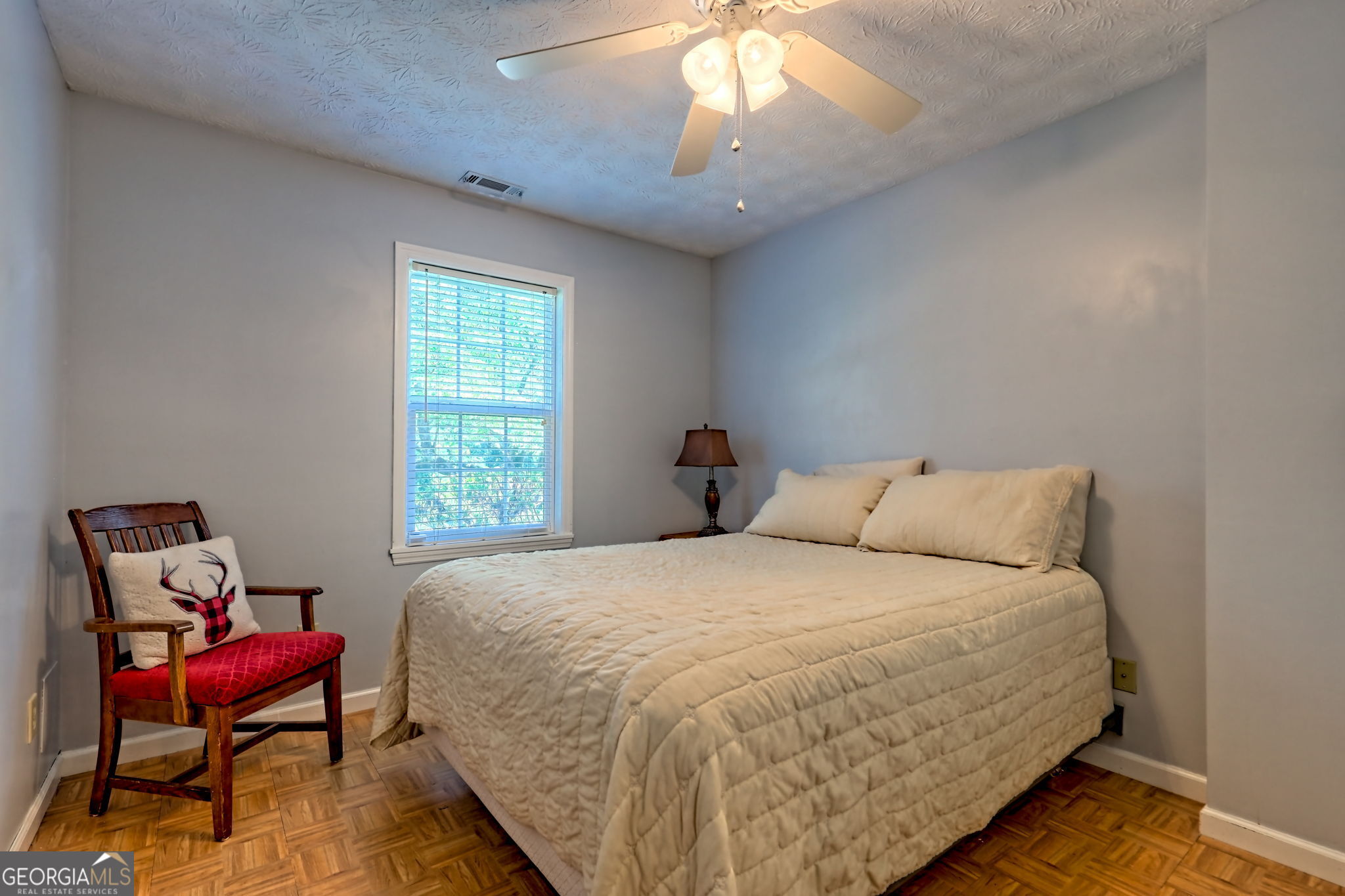 101 Long Street Demorest, GA 30535 - Photo 27 of 61 a large bed sitting in a bedroom next to a window