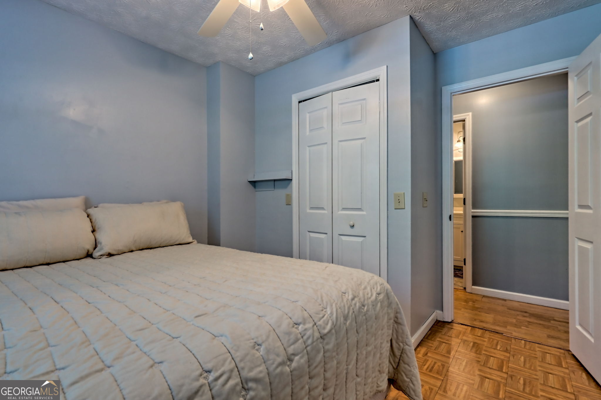 101 Long Street Demorest, GA 30535 - Photo 28 of 61 a bedroom with a bed and a walk in closet