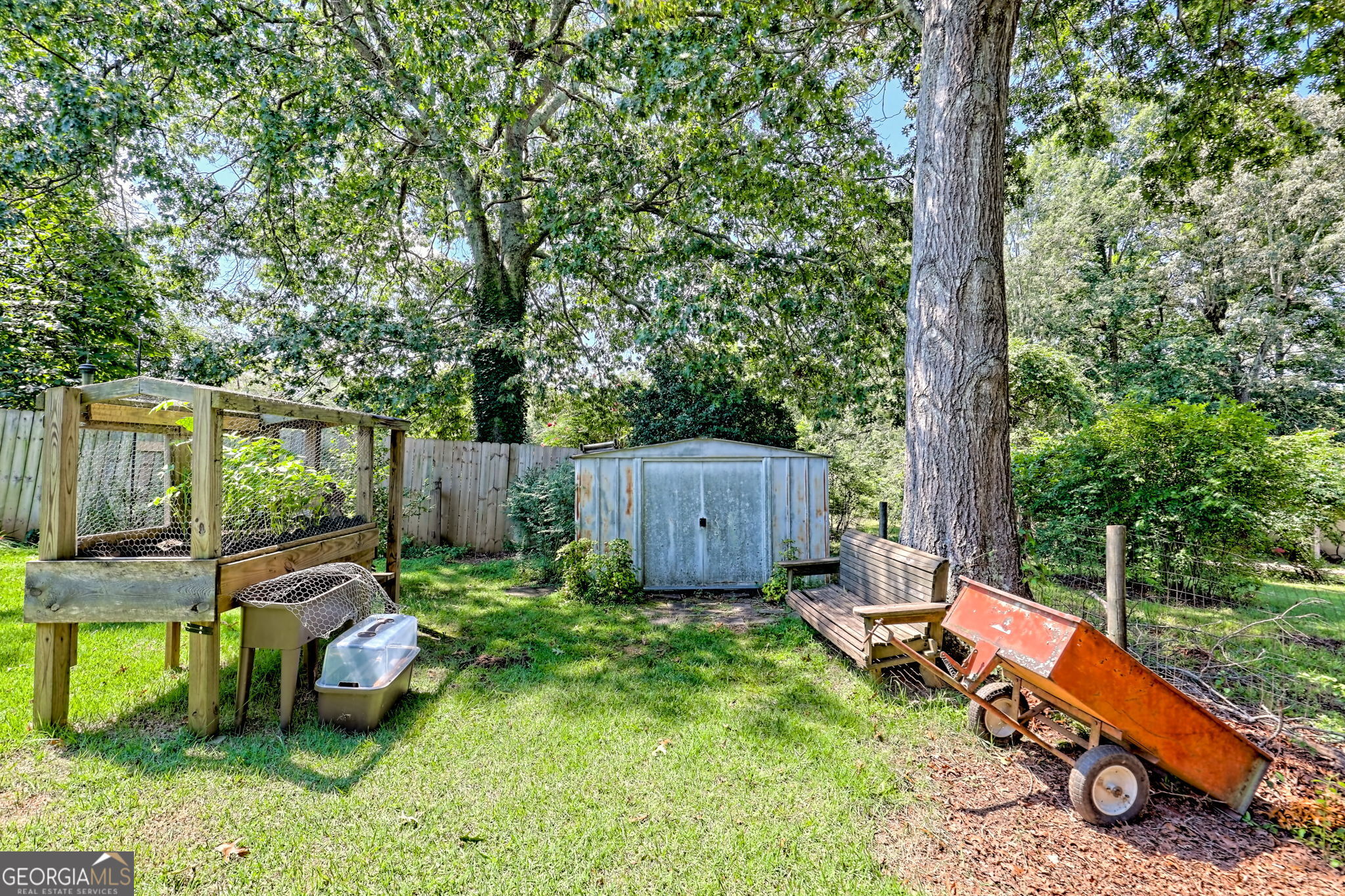 101 Long Street Demorest, GA 30535 - Photo 44 of 61 a backyard of a house with fountain table and chairs