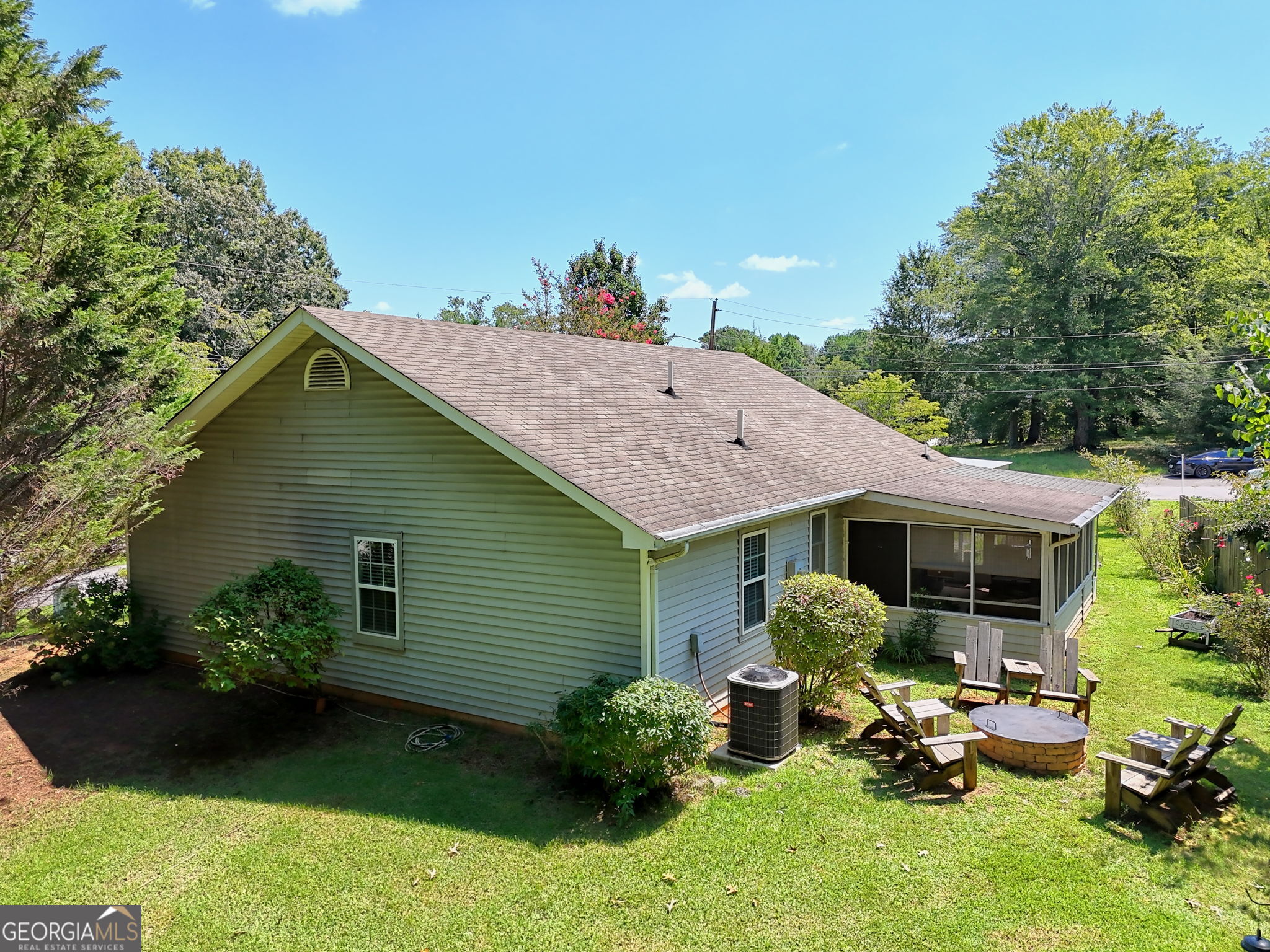 101 Long Street Demorest, GA 30535 - Photo 46 of 61 a backyard of a house with table and chairs plants and large tree