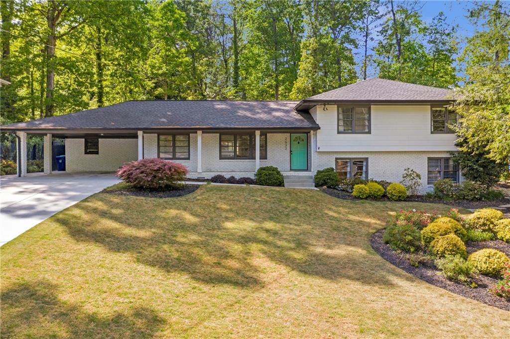 2632 Hawthorne Place Northeast Atlanta, GA 30345 - Photo 1 of 40 a front view of a house with a yard