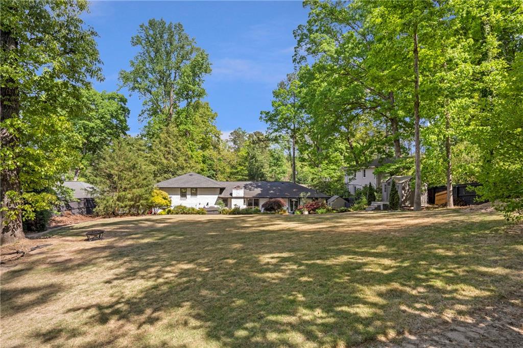 2632 Hawthorne Place Northeast Atlanta, GA 30345 - Photo 11 of 40 a front view of a house with a yard and trees