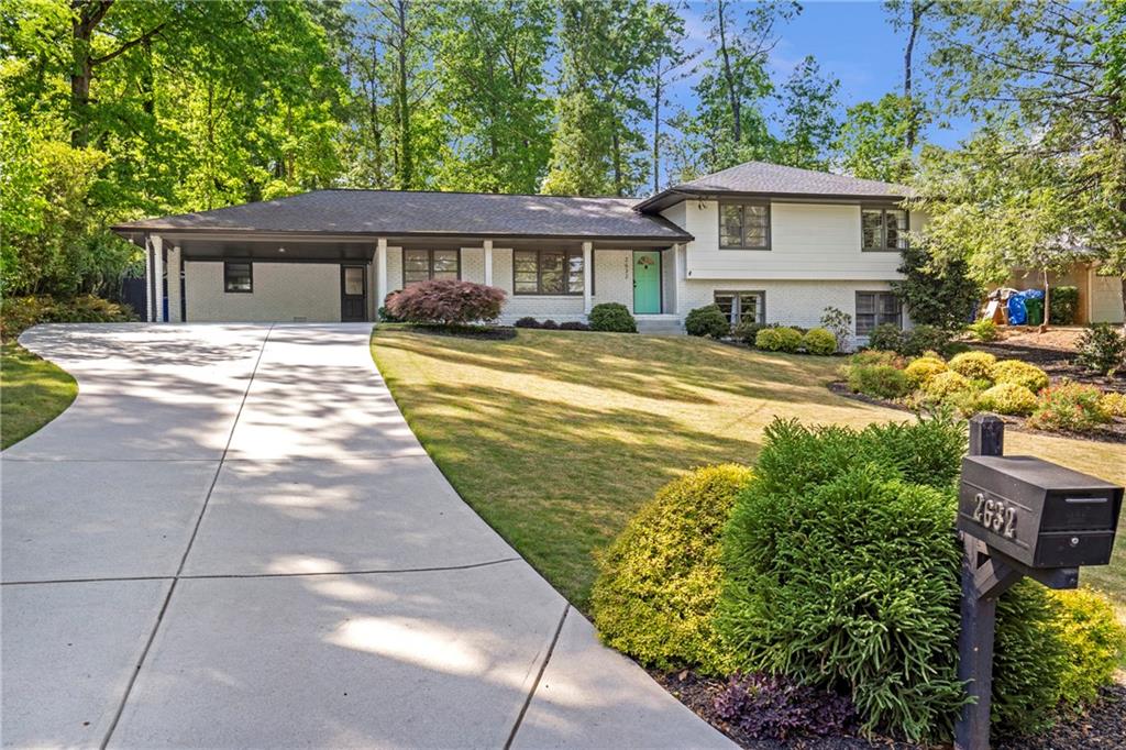 2632 Hawthorne Place Northeast Atlanta, GA 30345 - Photo 2 of 40 a front view of a house with garden