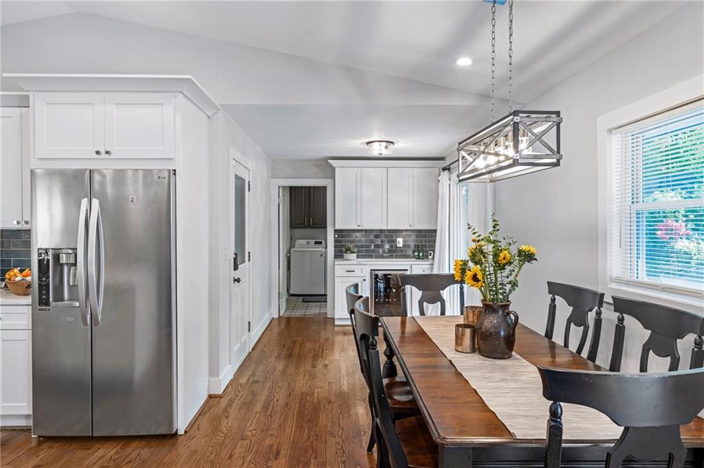 2632 Hawthorne Place Northeast Atlanta, GA 30345 - Photo 22 of 40 a kitchen with stainless steel appliances granite countertop a dining table chairs refrigerator and cabinets