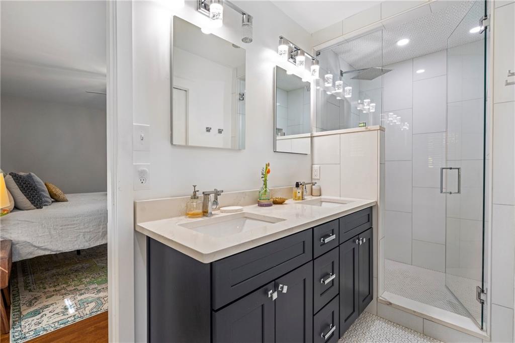 2632 Hawthorne Place Northeast Atlanta, GA 30345 - Photo 28 of 40 a bathroom with a sink vanity and a mirror