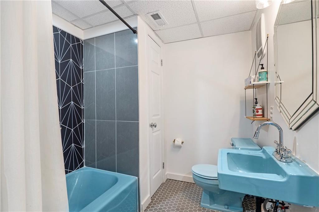 2632 Hawthorne Place Northeast Atlanta, GA 30345 - Photo 36 of 40 a bathroom with a sink toilet and shower